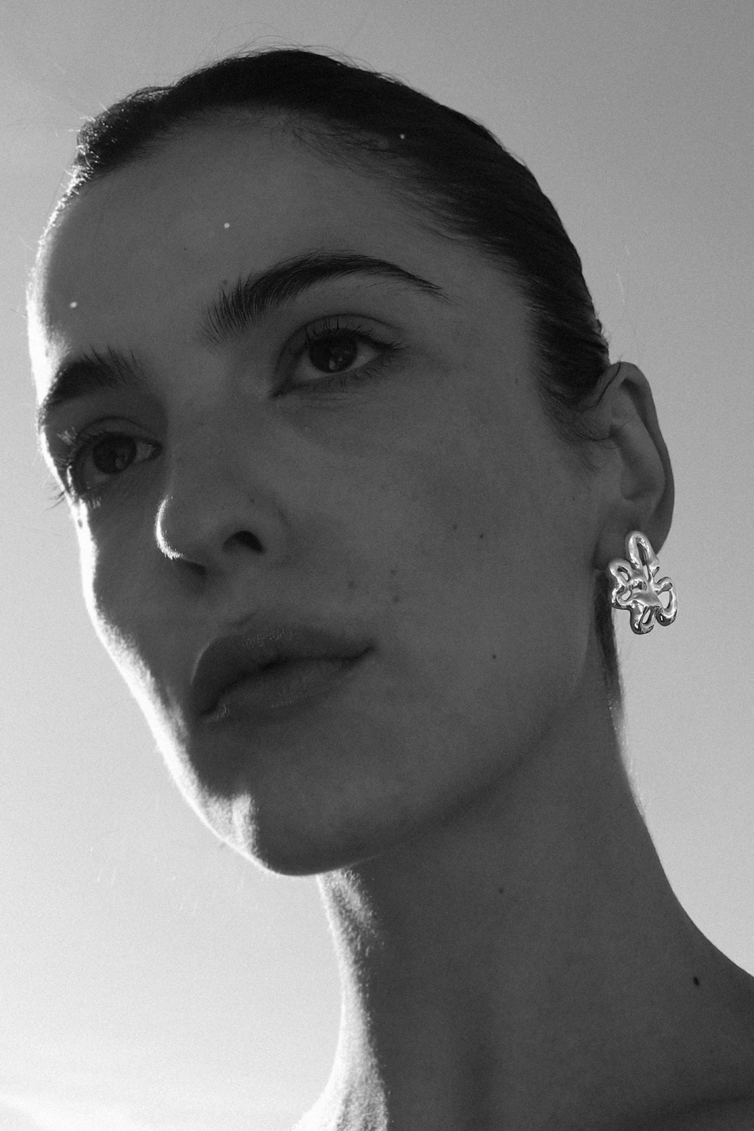 Statement flower earrings in silver by Julie Thevenot jewelry